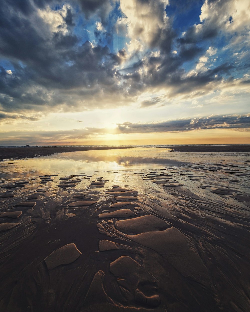 body of water under blue sky during sunset