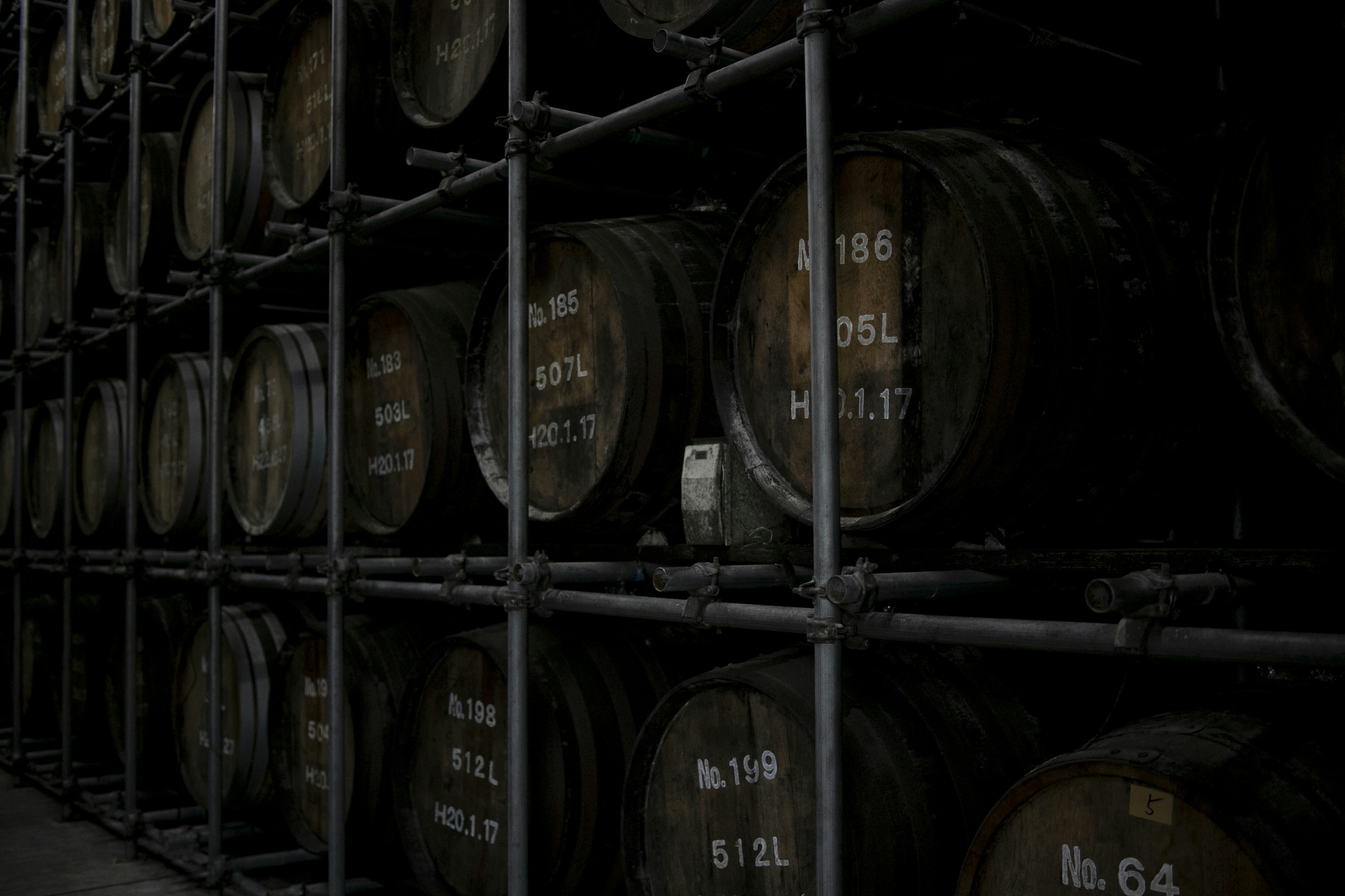 brown wooden barrels on brown wooden shelf, Shochu Brewery Iki Island