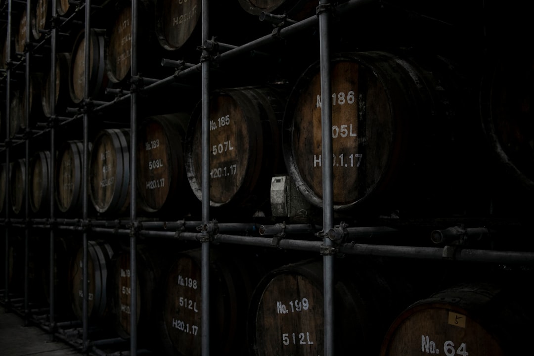 brown wooden barrels on brown wooden shelf