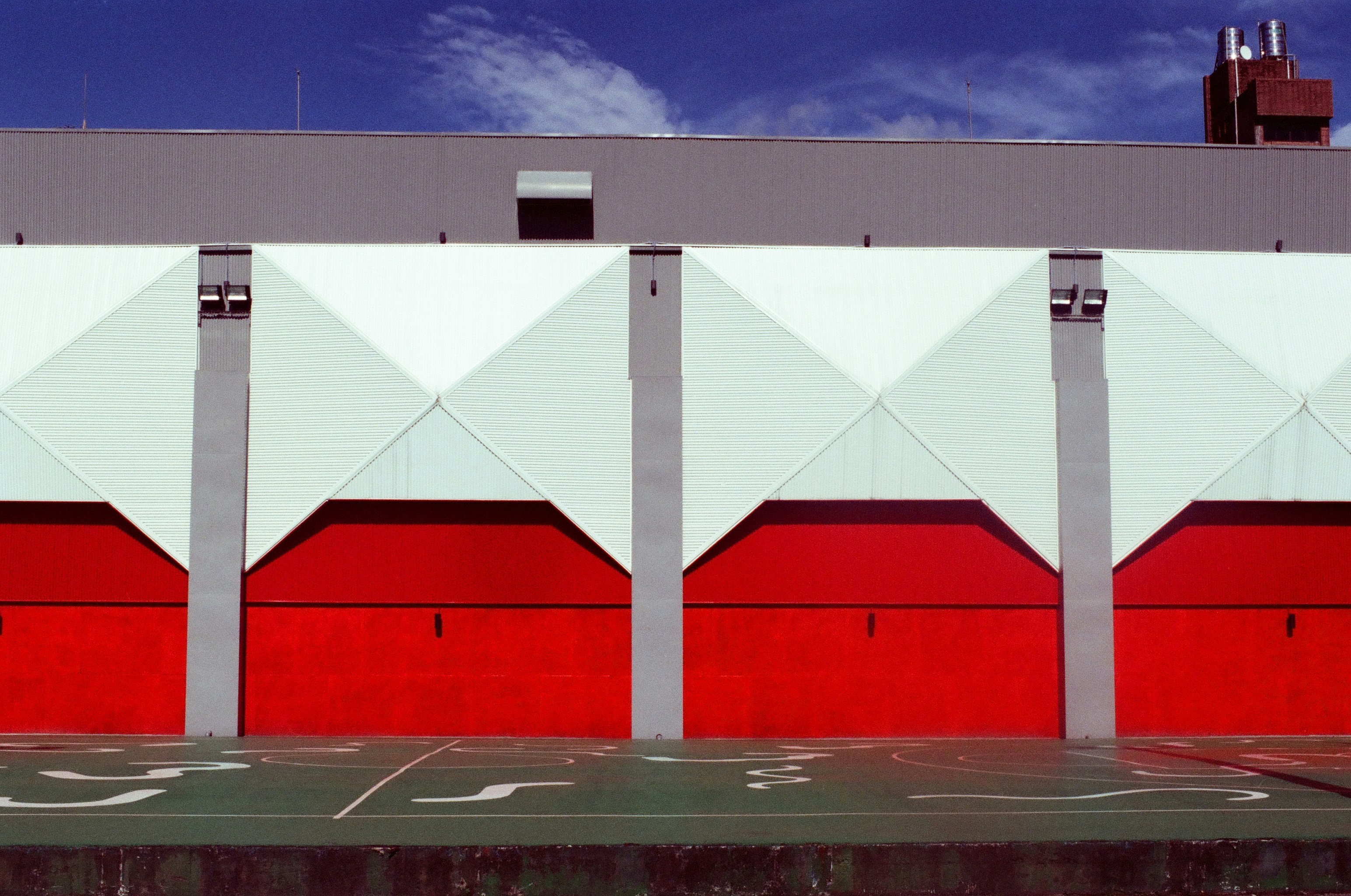 white and red building under blue sky