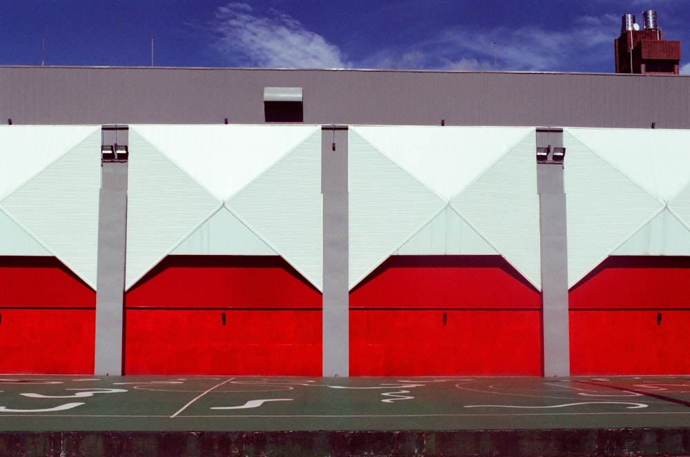 white and red building under blue sky