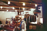 Warm interior shot of the family-owned Barocco’s Clothing store with vintage clothing racks and classic wooden counters.