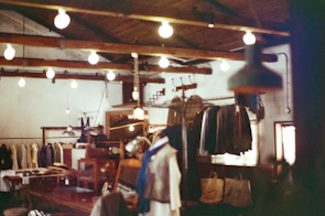 Warm interior shot of the family-owned Barocco’s Clothing store with vintage clothing racks and classic wooden counters.