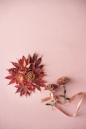 Flat lay of popular Korean sheet masks with fresh flowers on a wooden table