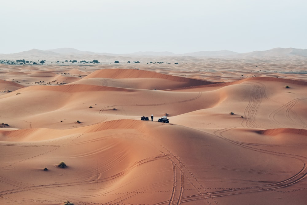 people walking on desert during daytime