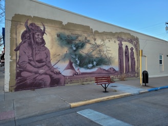 A vibrant mural depicting Chief Washakie surrounded by community members in traditional attire.