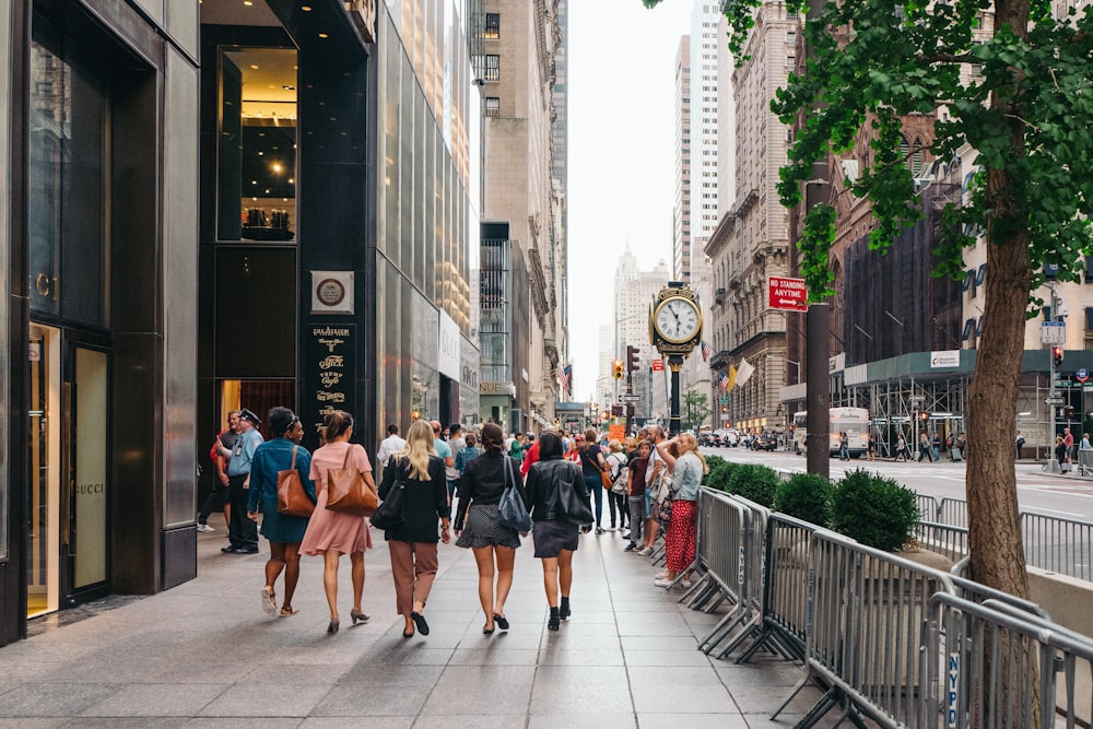 people walking on sidewalk during daytime