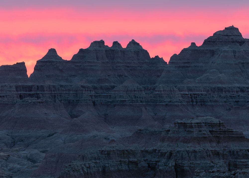 brown rocky mountain during sunset