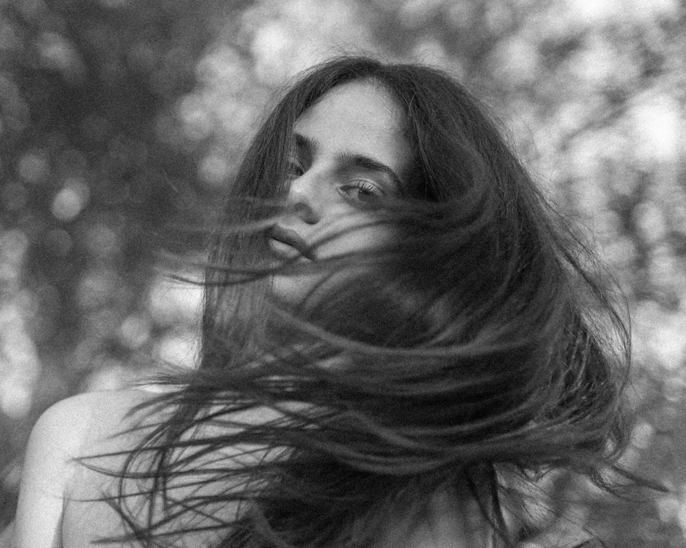 grayscale photo of woman with long hair