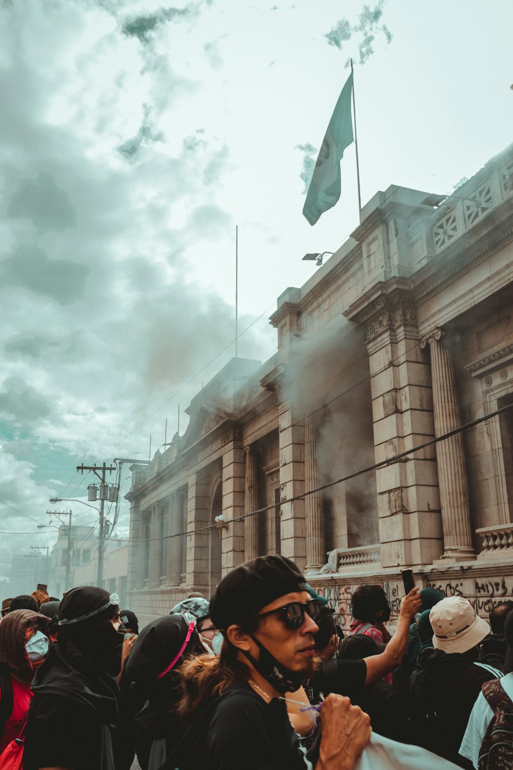 people standing near brown concrete building during daytime