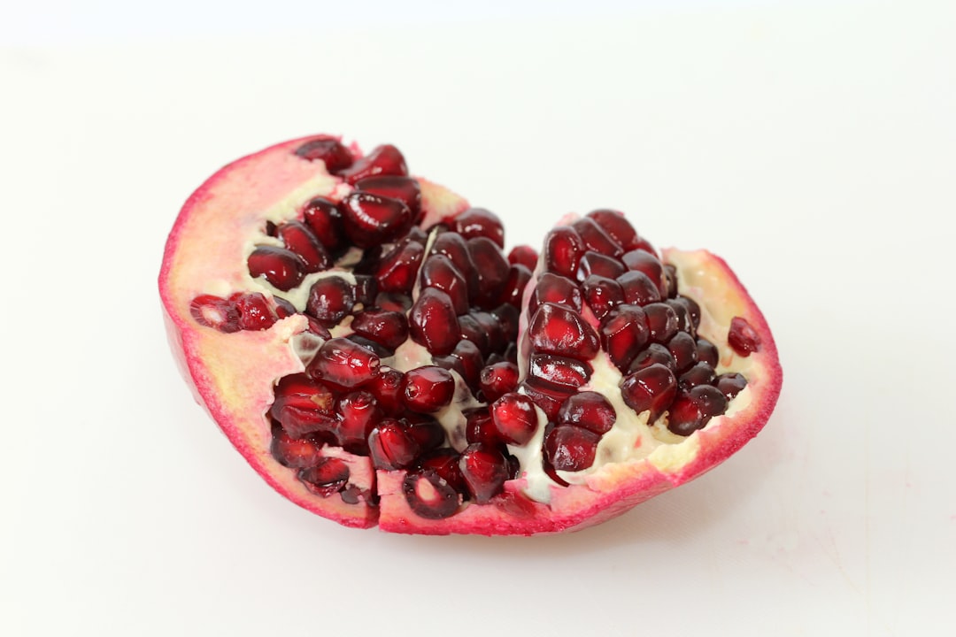 red and black fruit on white surface