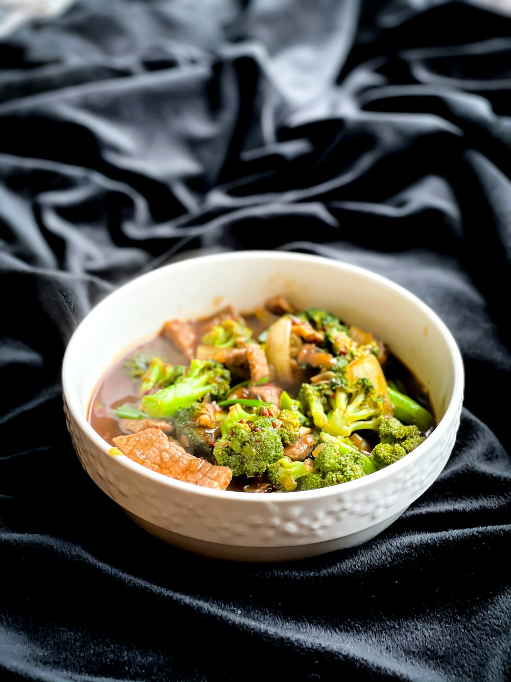 green vegetable in white ceramic bowl