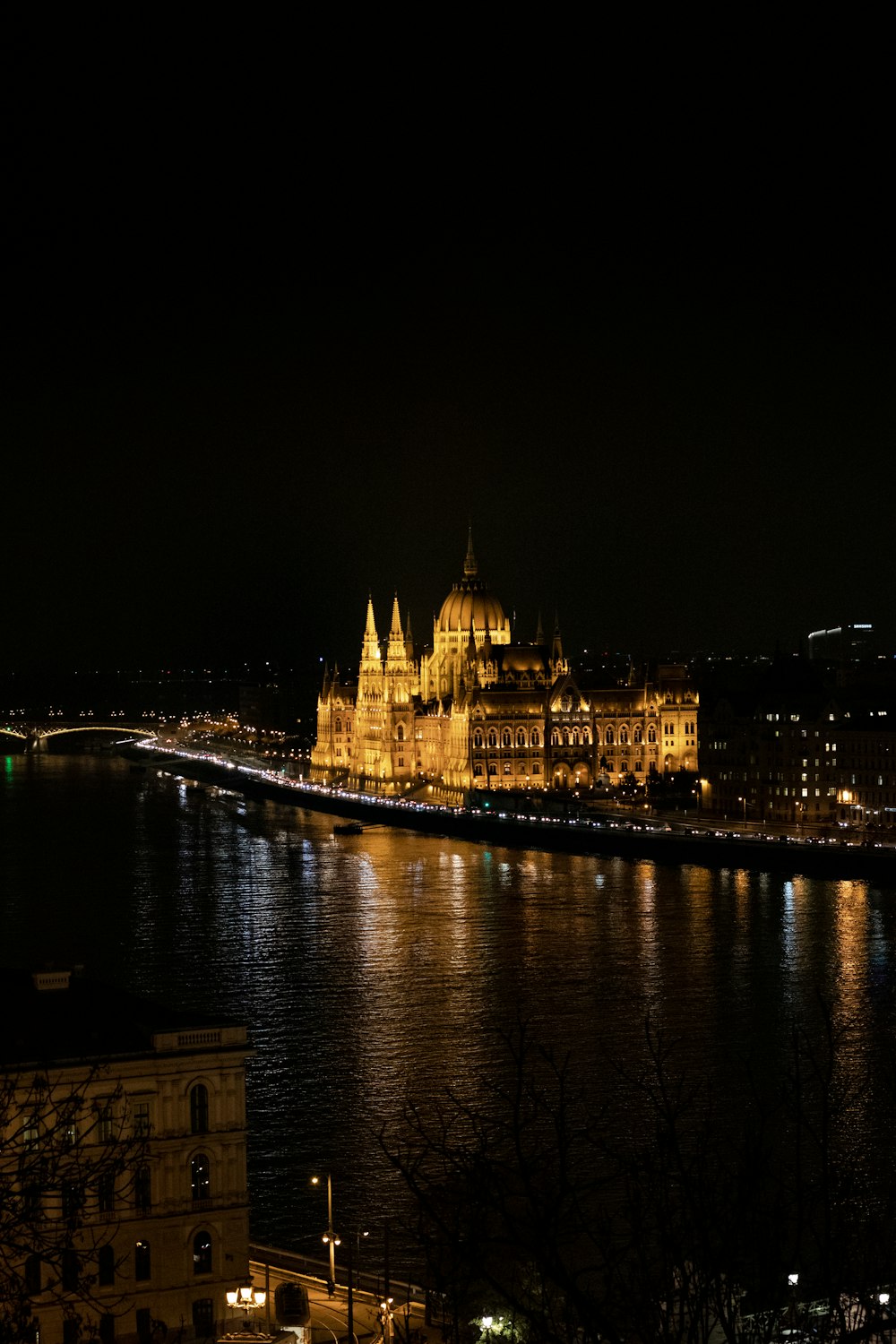 a night time view of a city and a river