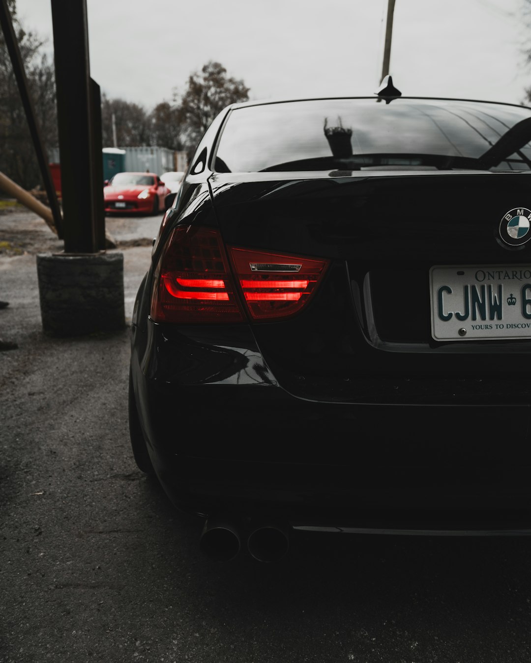 black bmw m 3 parked on parking lot during daytime