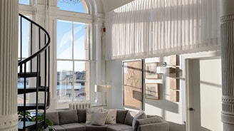 gray sofa near white wooden cabinet