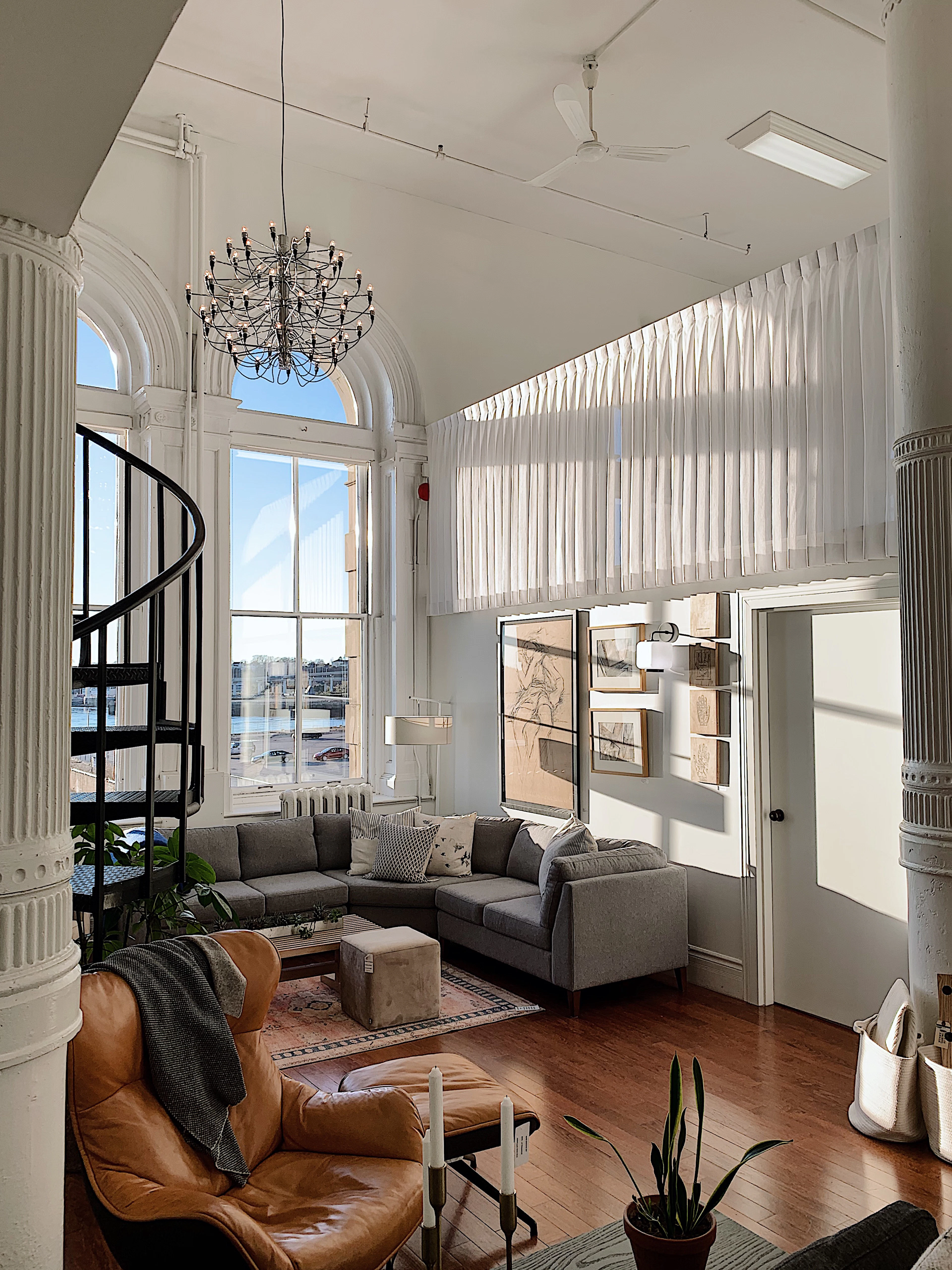 Grey sofa near a white cabinet