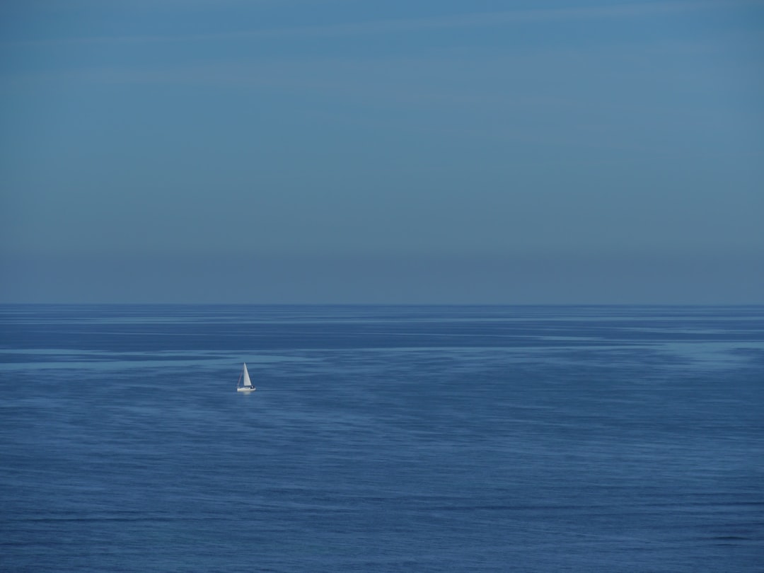 white sailboat on sea during daytime