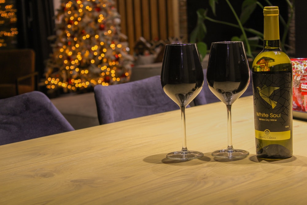 2 clear wine glasses on table