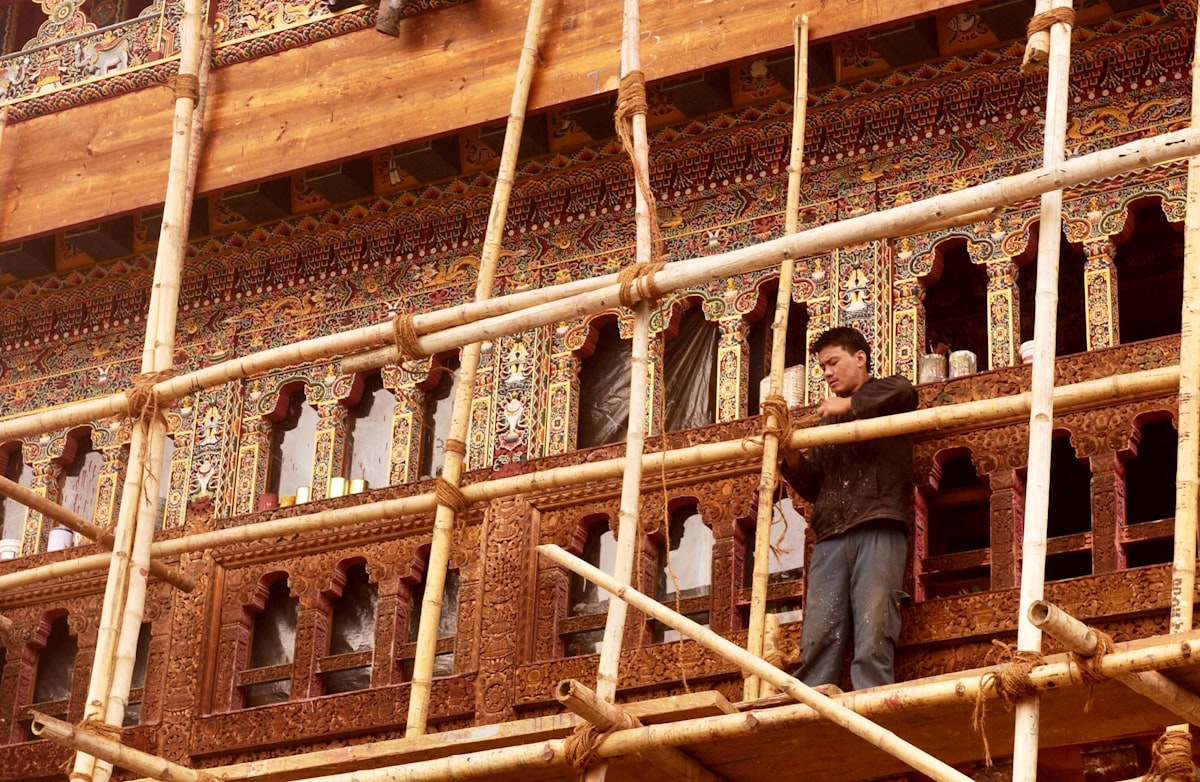 Bhutan dzong fortress with crystal-clear Himalayan autumn sky and snow peaks
