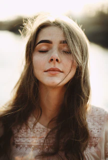 woman in white floral lace shirt