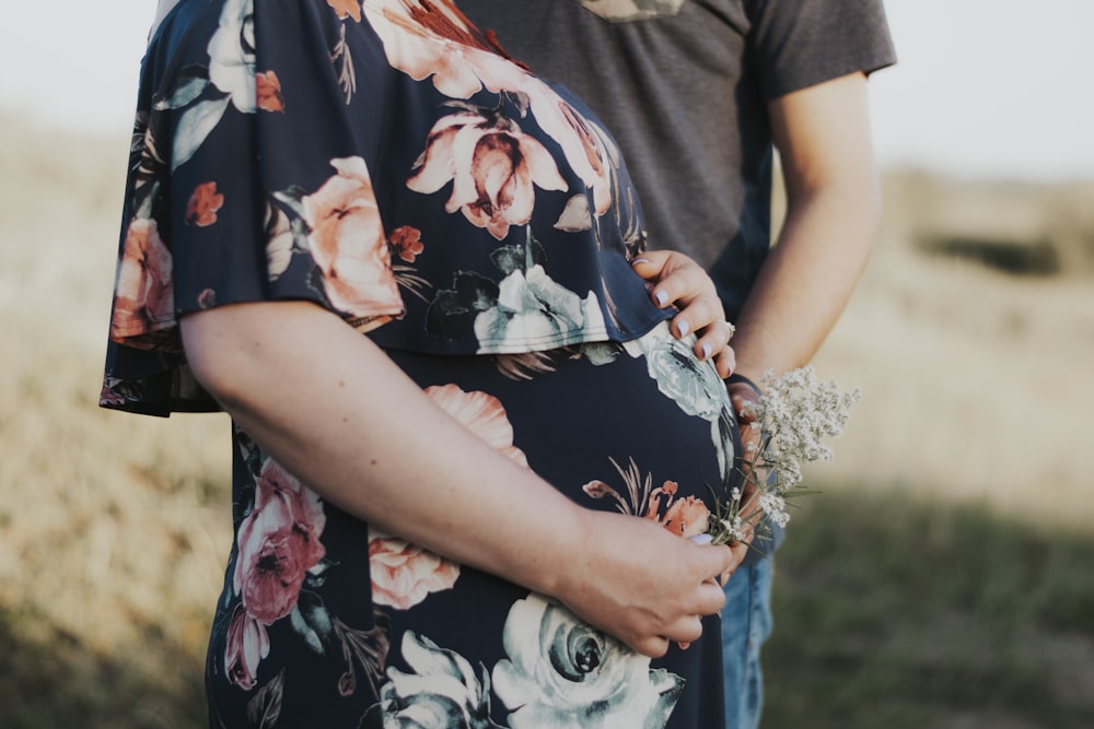 woman in black white and red floral dress