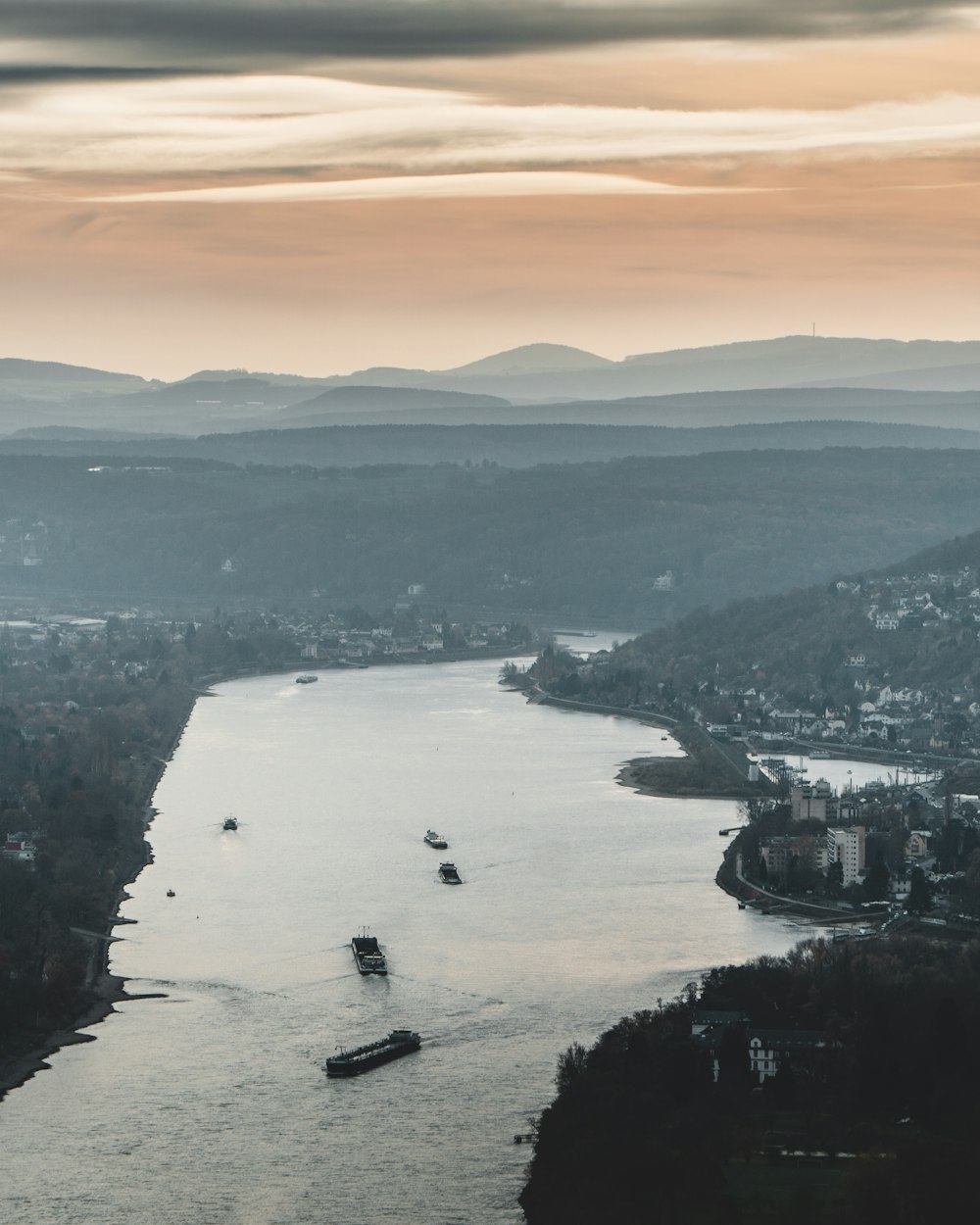 aerial view of body of water near mountain during daytime