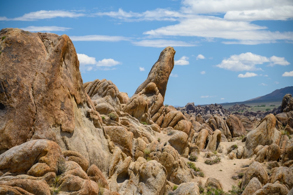 brown rock formation near body of water during daytime