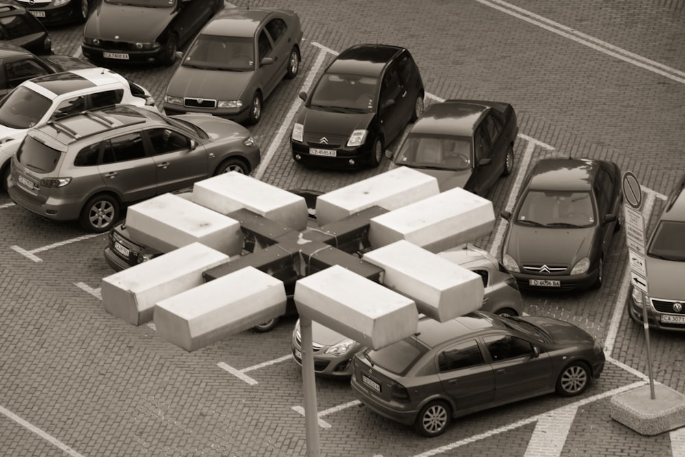 black car parked beside white concrete building