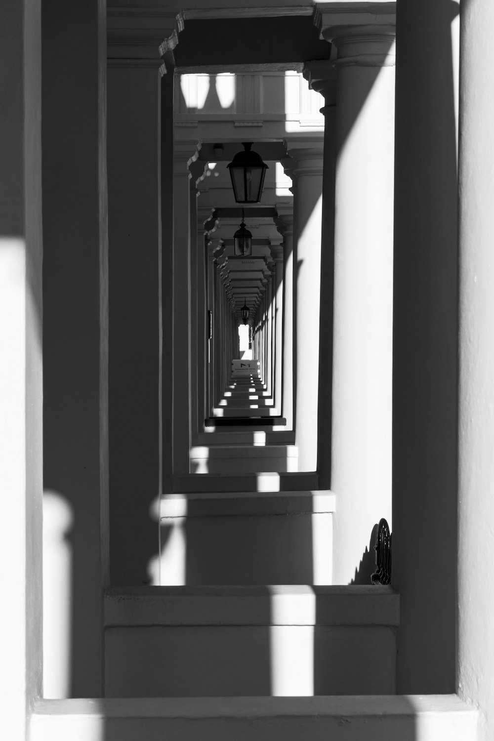 grayscale photo of concrete pillar