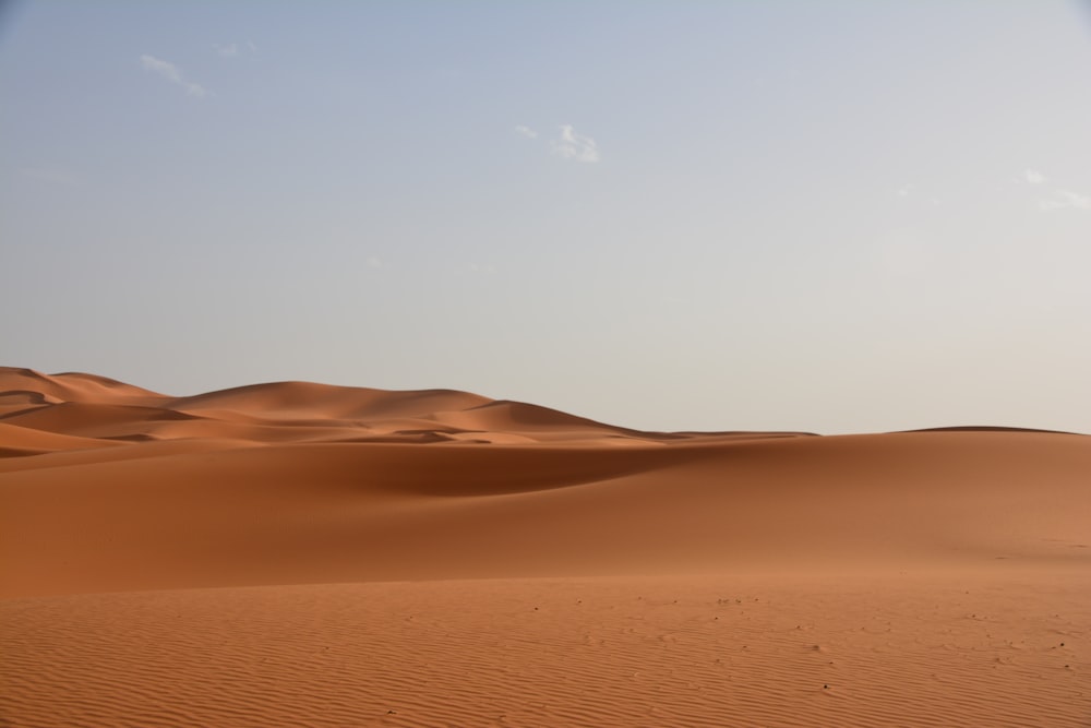 brown sand under blue sky during daytime