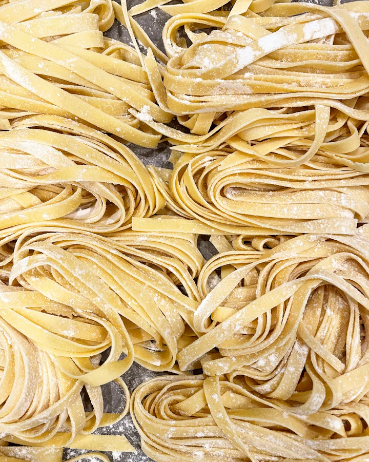 Nests of fresh tagliatelle dusted with flour