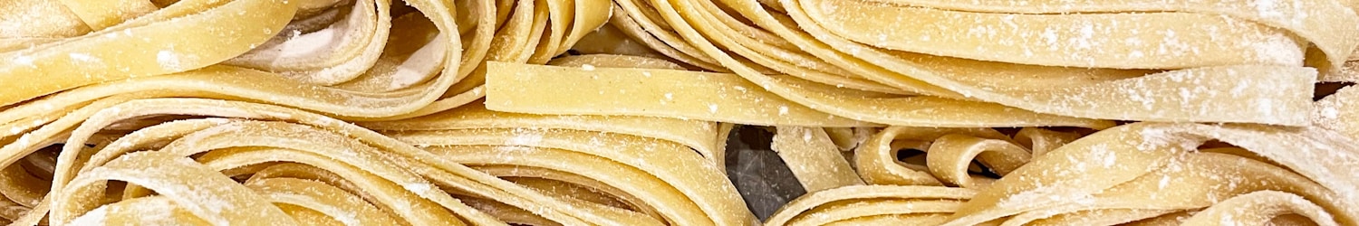 yellow pasta on stainless steel tray