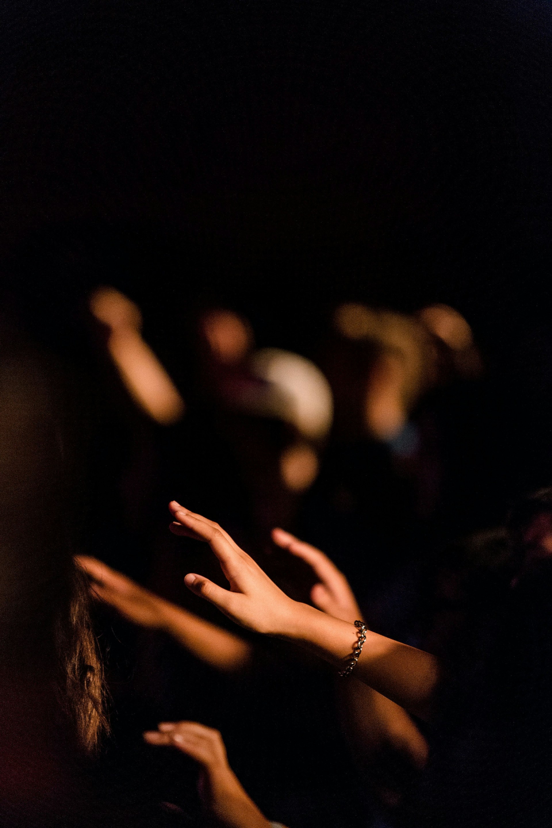person wearing silver bracelet and ring
