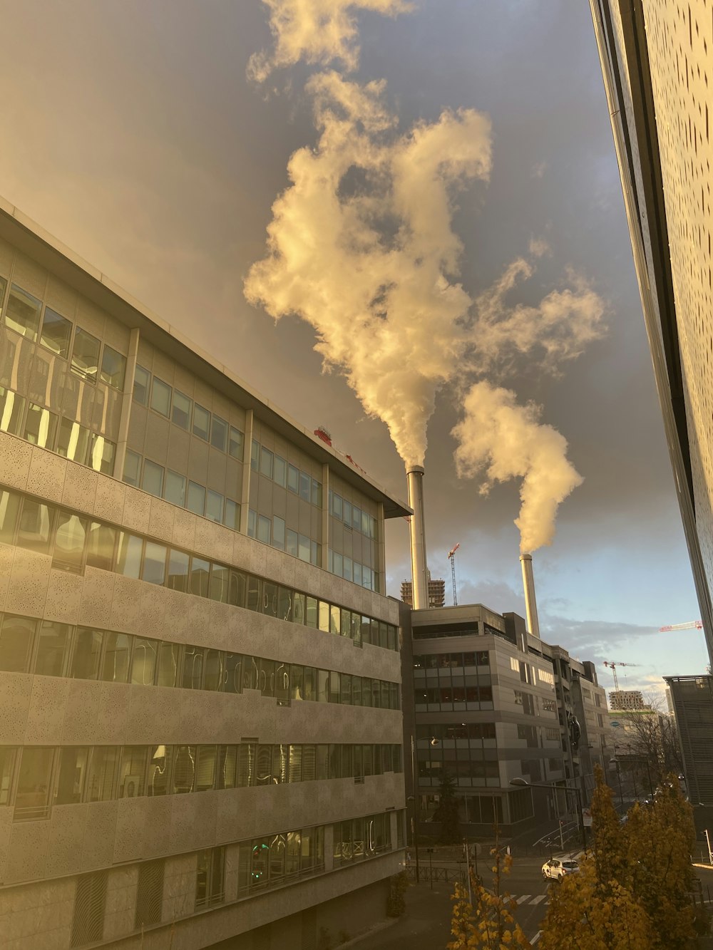 white clouds over city buildings during daytime