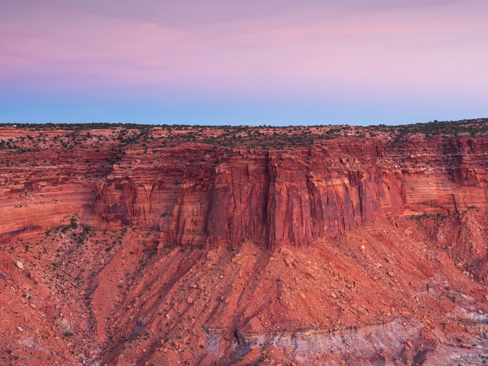 brown rock formation under blue sky during daytime