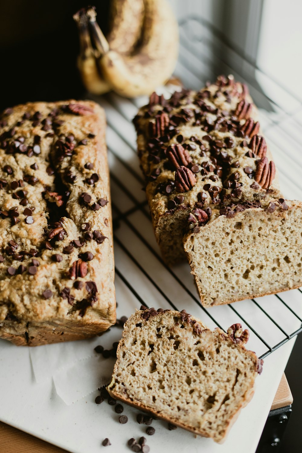 brown and black bread on white and green paper