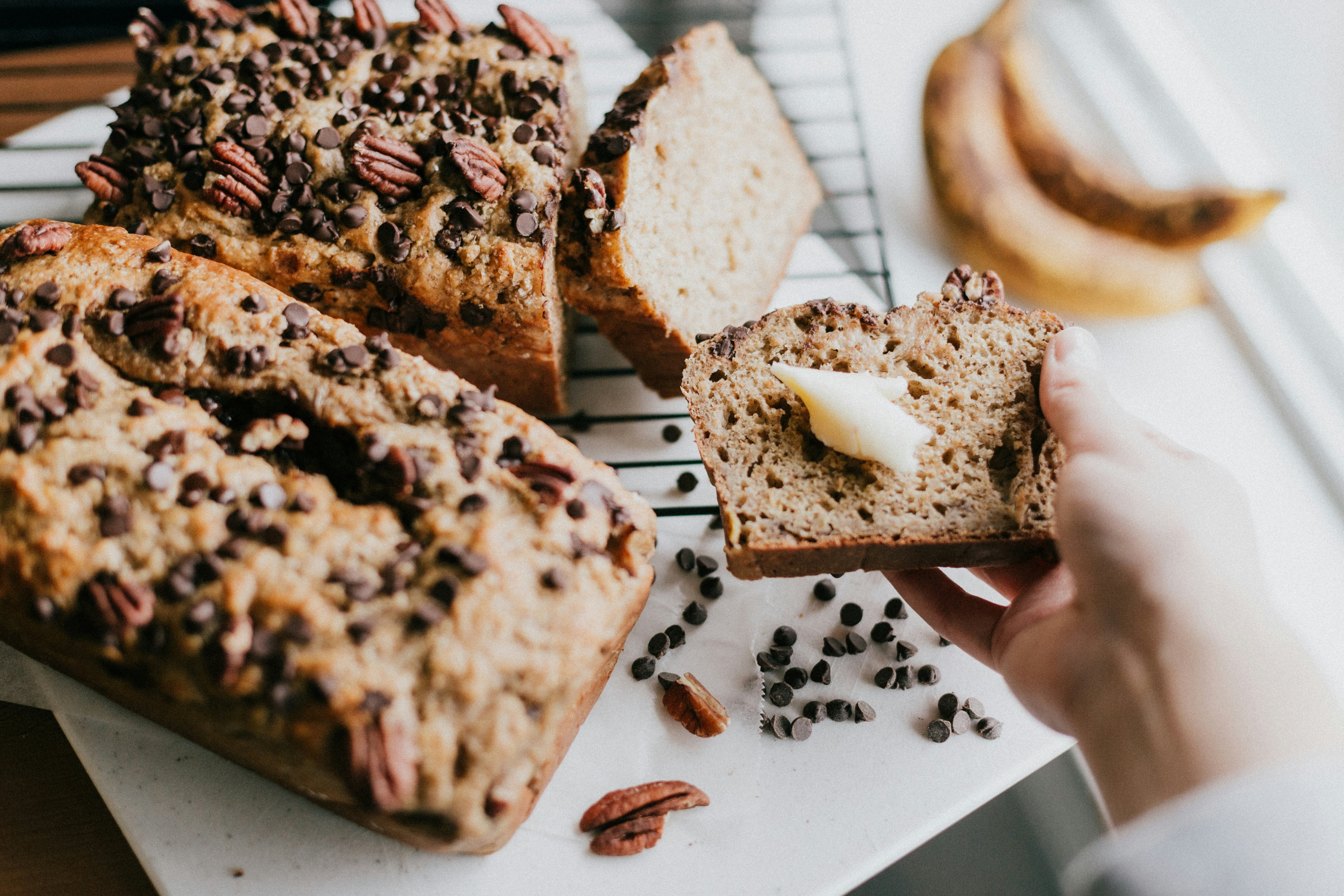 person holding bread with chocolate and milk