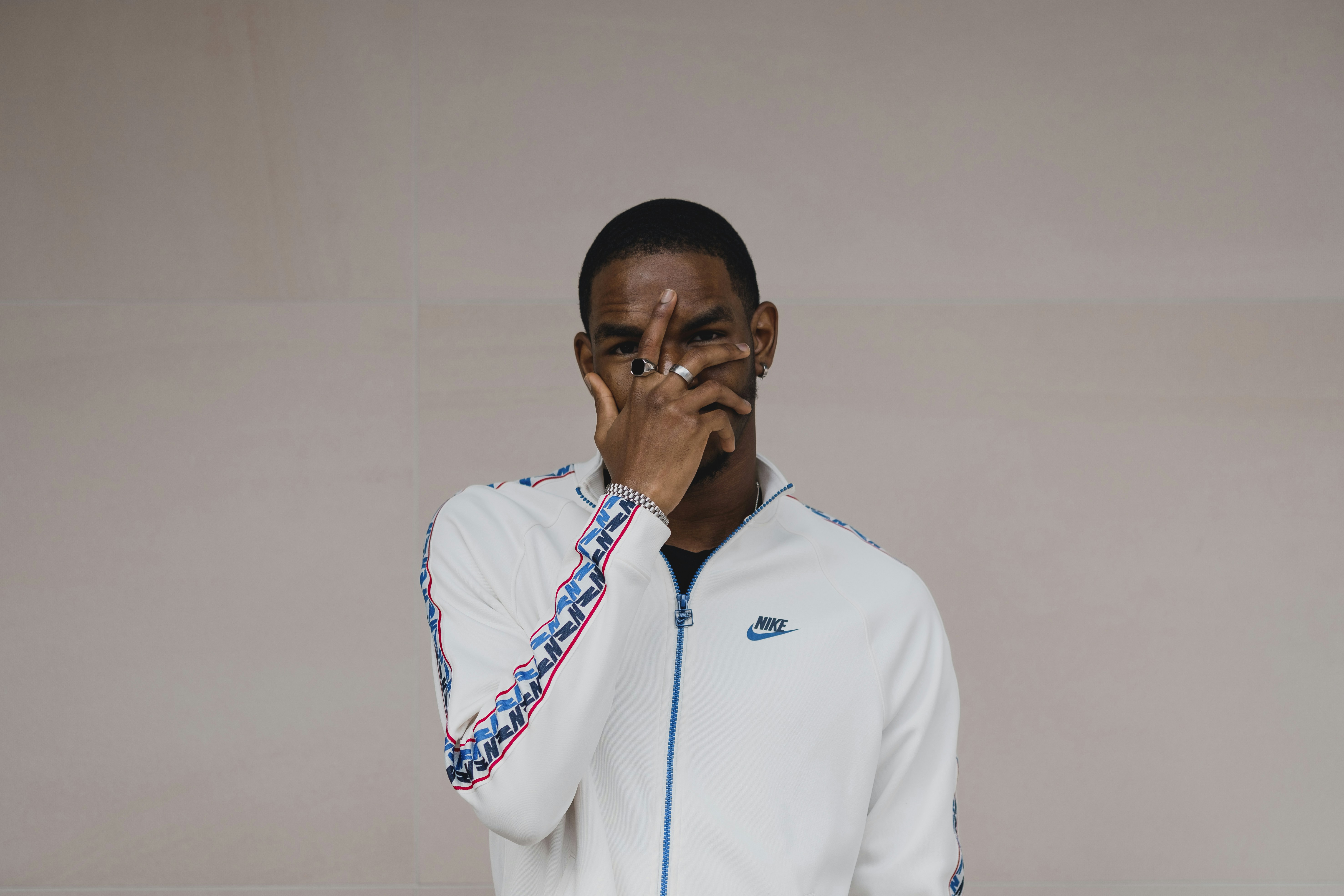 man in white zip up jacket