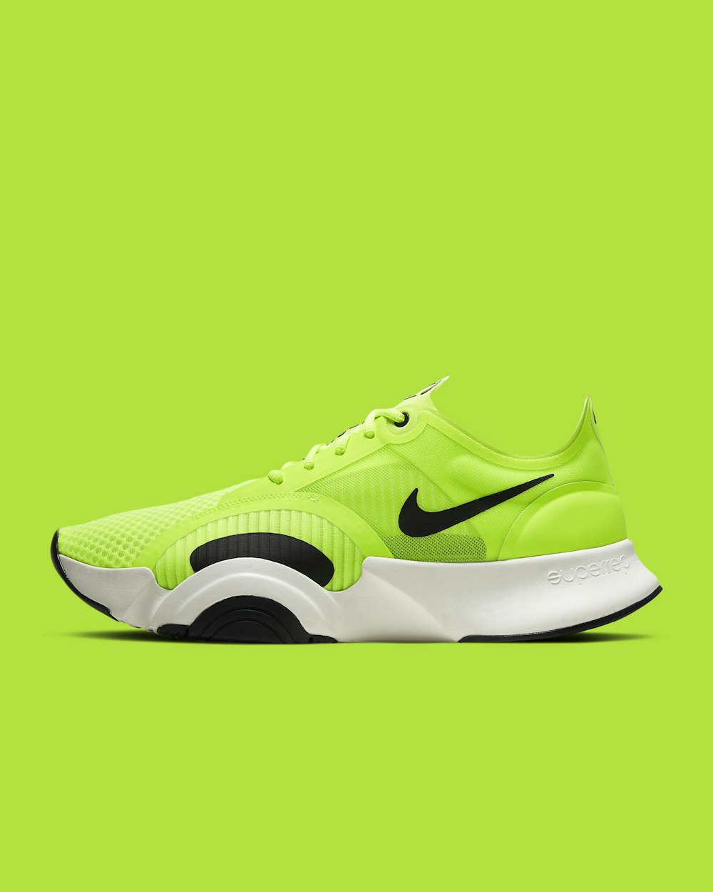 green and black nike athletic shoe