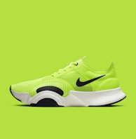 green and black nike athletic shoe