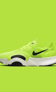 green and black nike athletic shoe