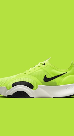 green and black nike athletic shoe