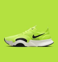 green and black nike athletic shoe