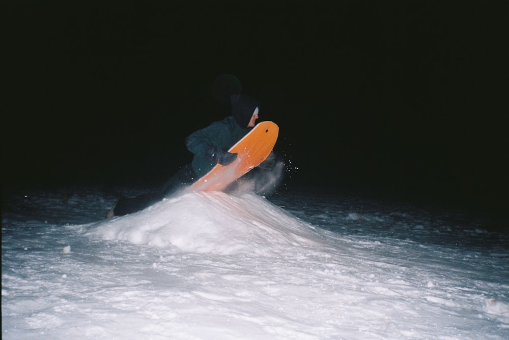 person surfing on sea waves during daytime