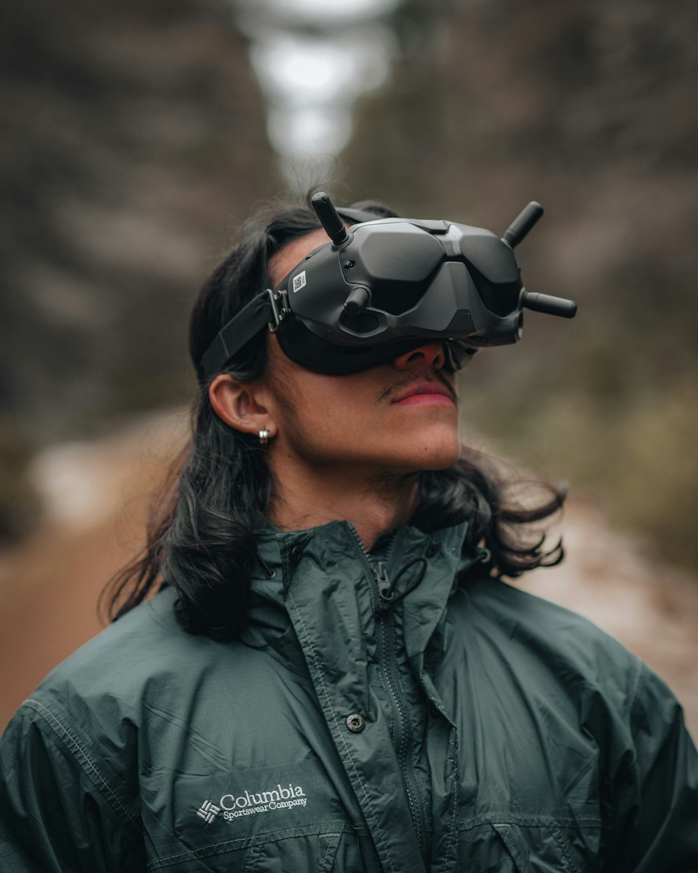 woman in black leather jacket wearing black sunglasses