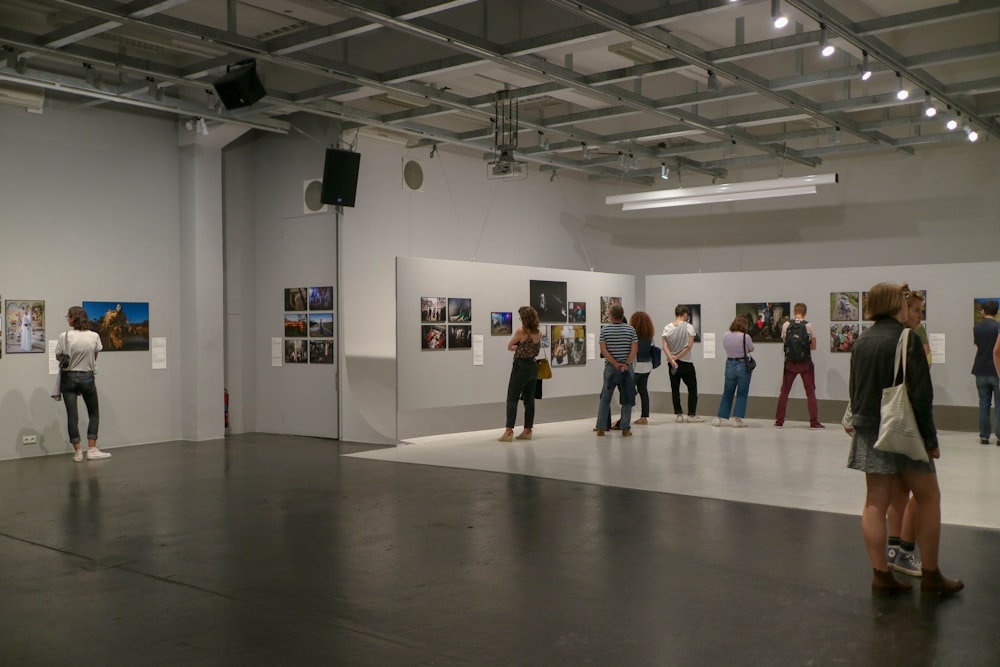 people standing on gray floor