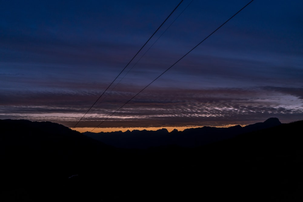 silhouette of mountains during sunset