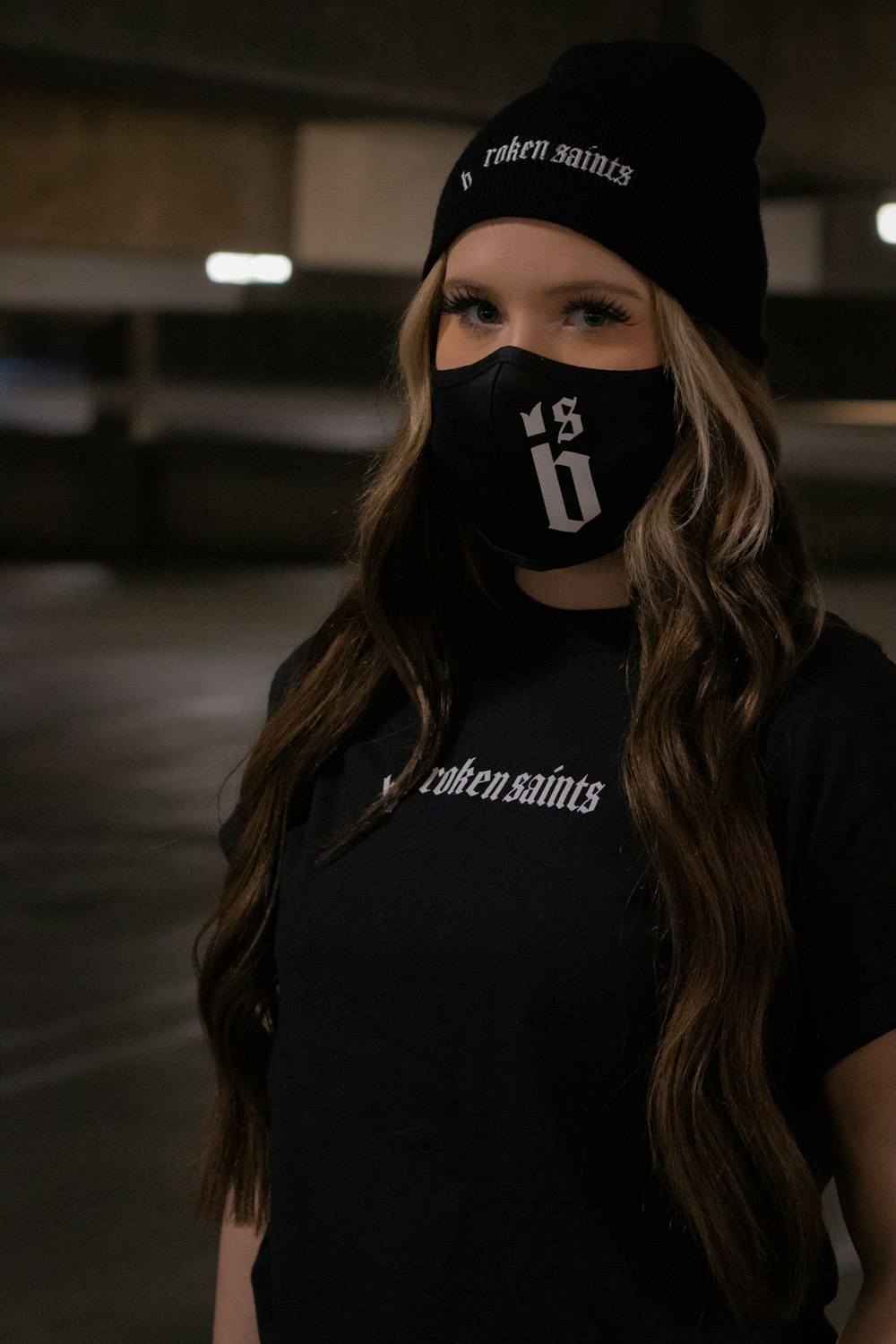 woman in black and white adidas shirt wearing black and white mask