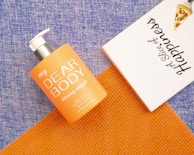 white and orange calvin klein perfume bottle