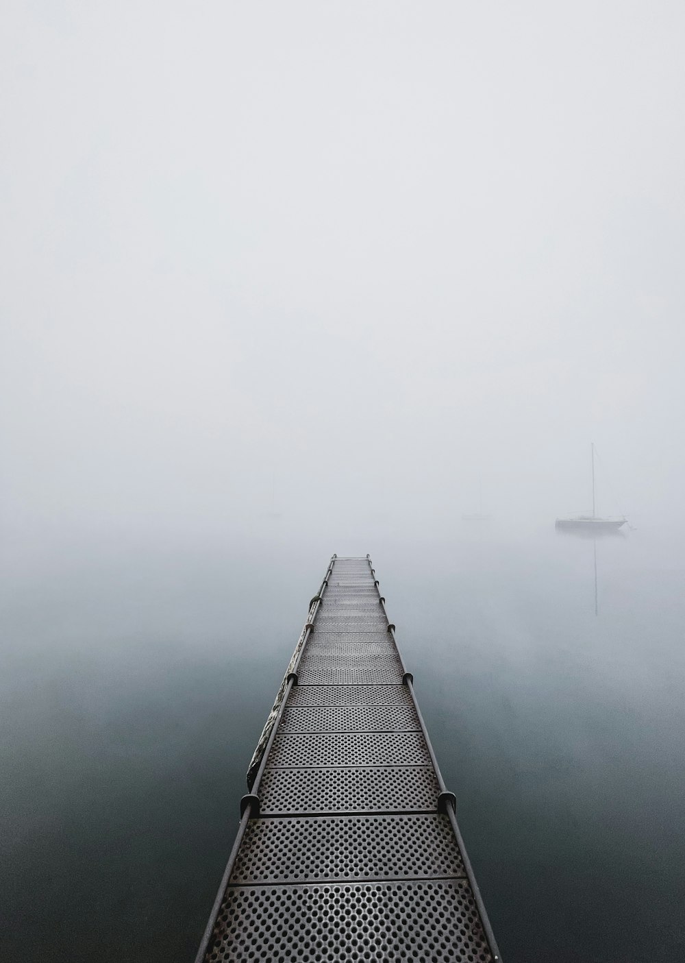 black and white boat on body of water